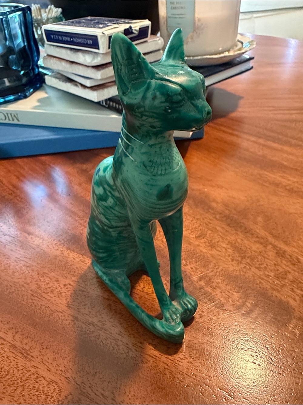 This is a lovely green-toned statue of the Egyptian cat goddess Bastet.